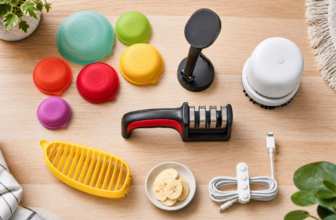 Quirky useful Amazon gadgets under $25 laid out on light wood - food huggers, phone mount, mini vacuum