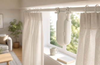 SwitchBot Curtain device clipped to curtain rod in bright living room with morning sunlight